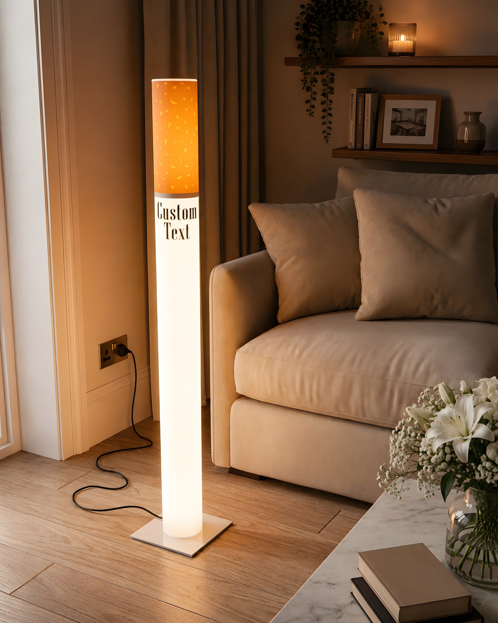 Giant cigarette lamp 95 cm glowing warm in a cozy neutral living room corner with a beige sofa and fresh flowers