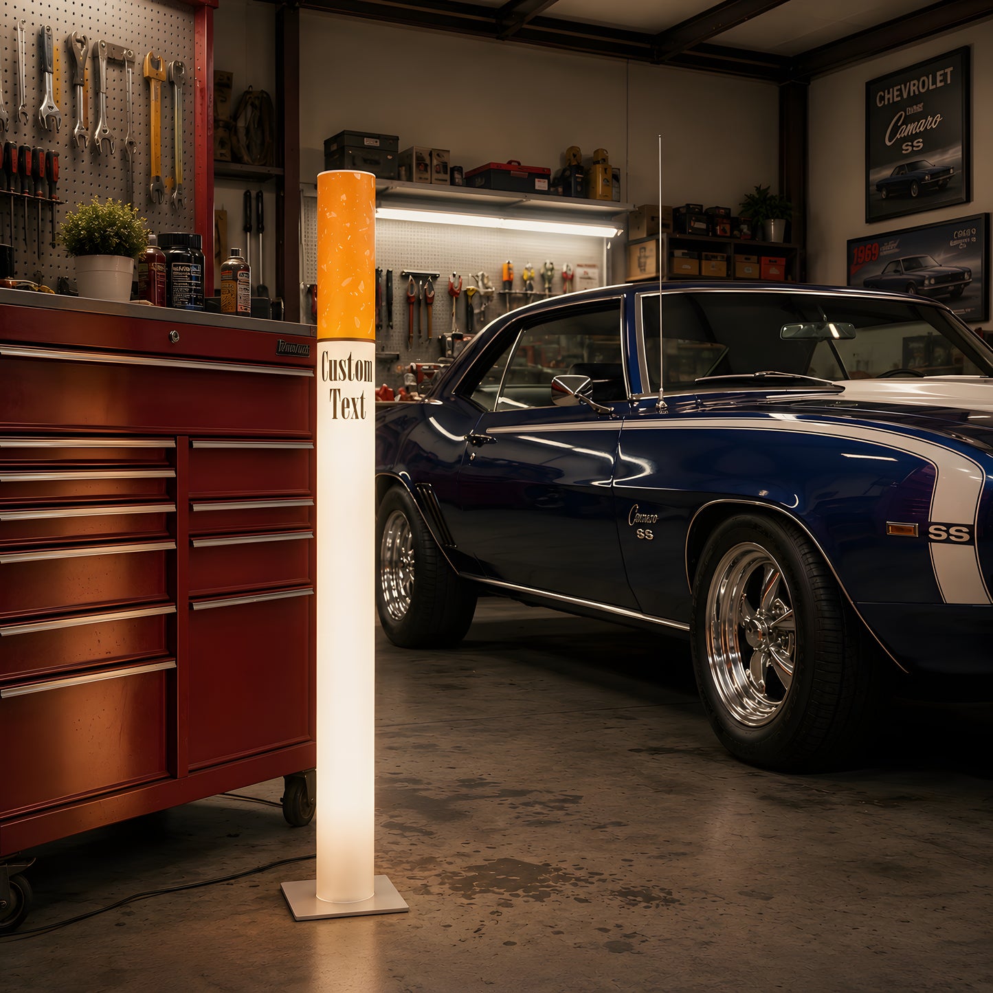 Giant cigarette floor lamp in a man cave garage next to a blue classic muscle car and a red rolling tool chest
