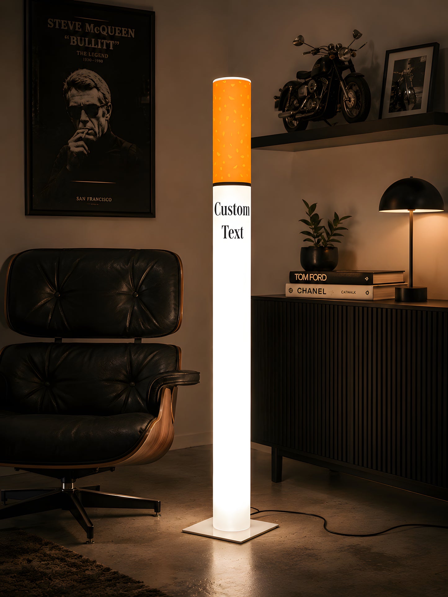 Novelty cigarette floor lamp in a mid century modern home office with a black leather lounge chair and vintage movie posters