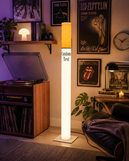 Giant cigarette floor lamp in a retro vinyl record room with a turntable console and classic rock band posters