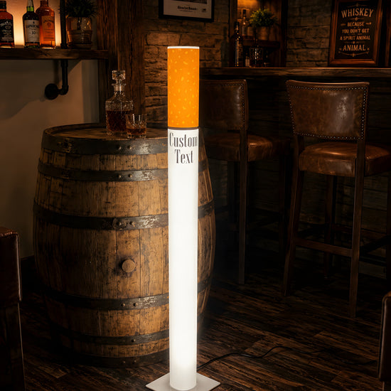 Vintage giant cigarette floor lamp 95 cm shown lit in a rustic home bar setting